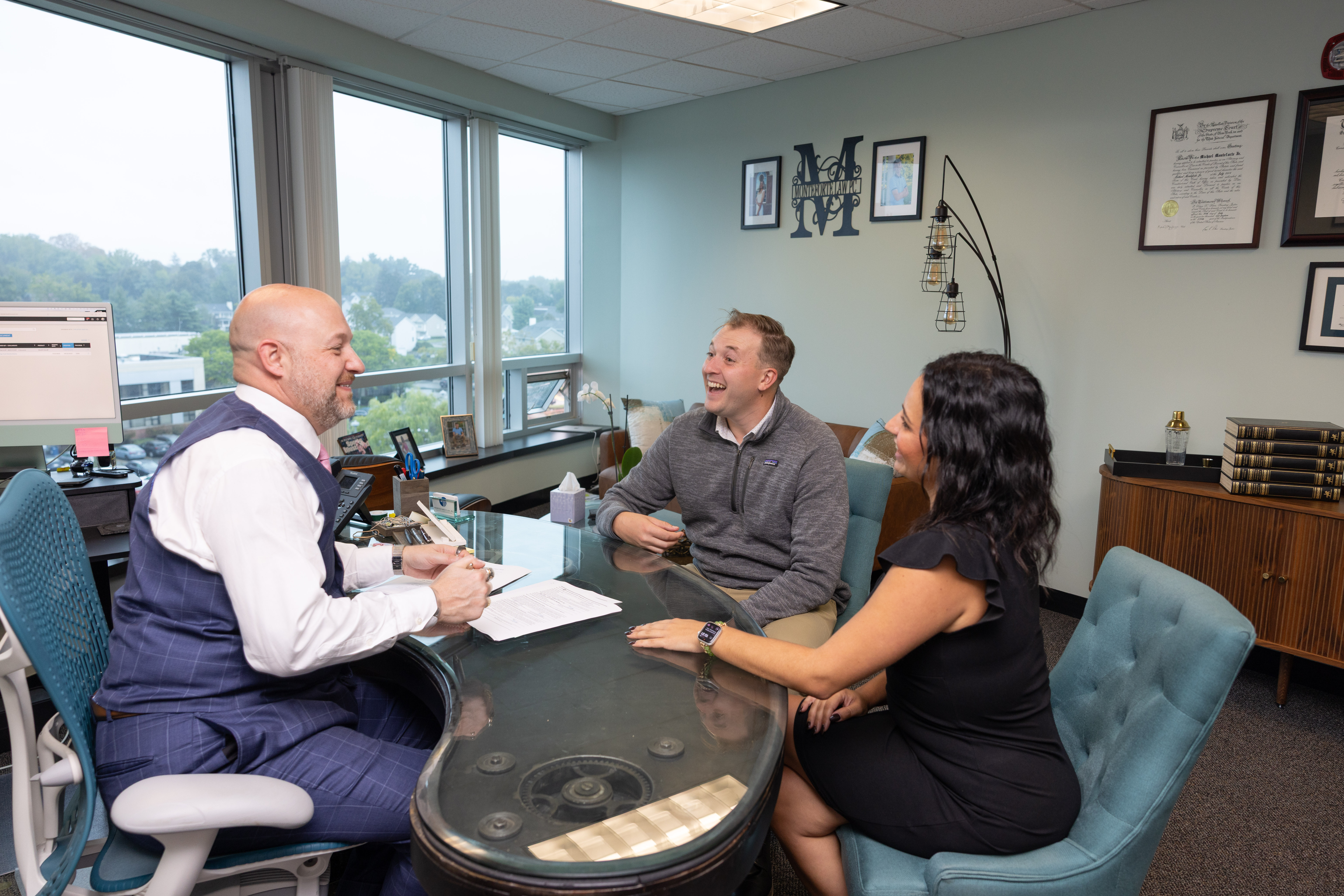 Attorney Monteforte consulting with clients
